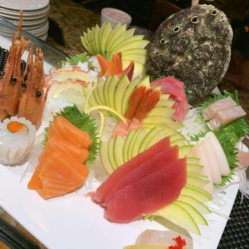 Grand sashimi platter with whole fish