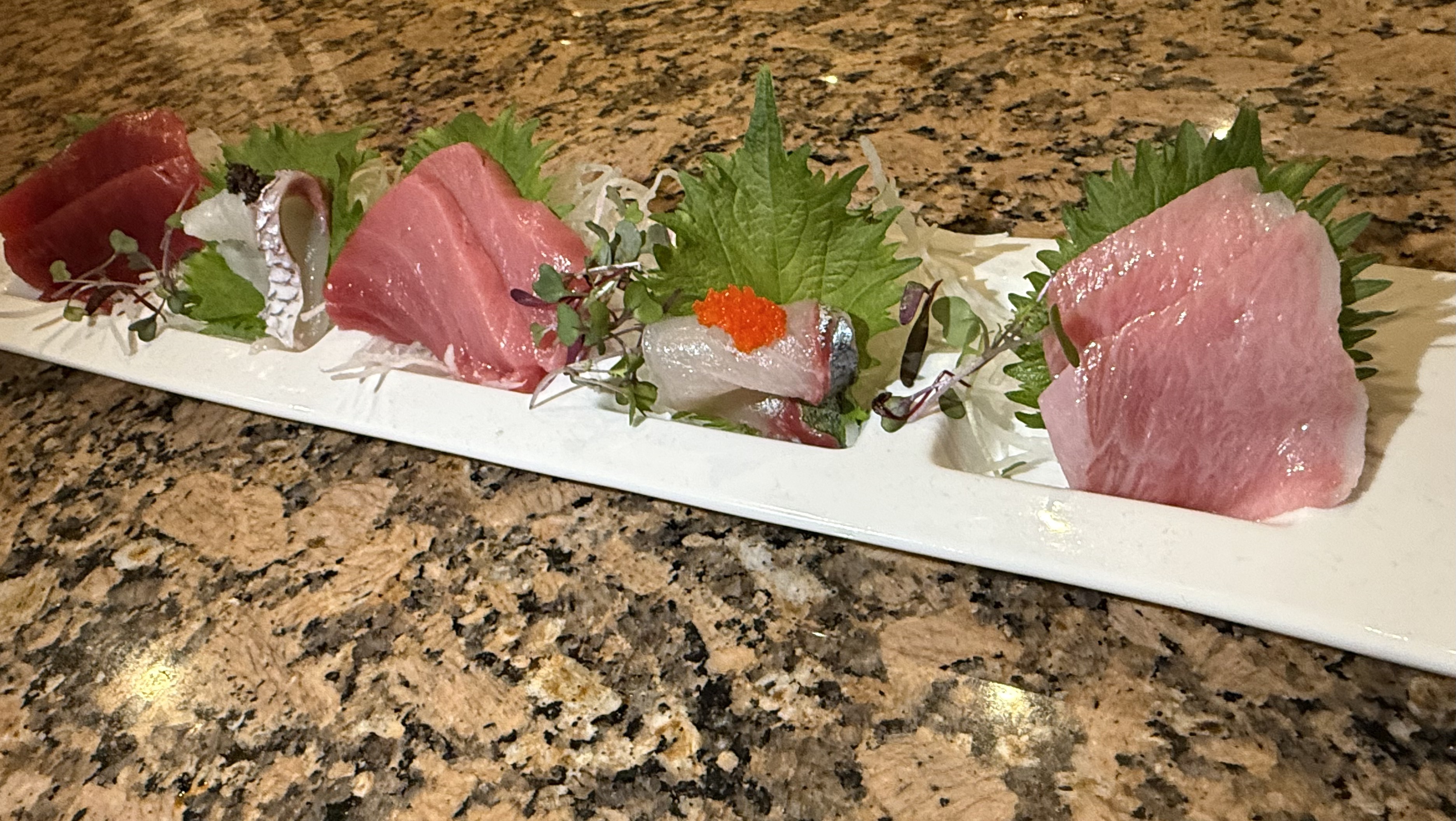 Mixed sashimi platter with shiso and tobiko